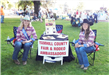Young ladies sitting at Yamhill County Fair and Rodeo Ambassadors table
