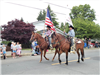 Fair Ambassadors riding horses in parade