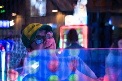 Man smiling surrounded by lights